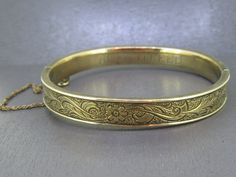 Gorgeous antique bangle bracelet. Signed gold filled.  Light wear to the finish, this is an antique piece so it has age related wear/patina.  Box clasp works great and has a safety chain.  Signed as you can see in the pictures and engraved with Alta M. Reed on the inside.  Visit Ribbons Edge for more great pieces of vintage and antique jewelry!  All items added to your cart at Ribbons Edge will automatically combine shipping. To stay up to date with my newest offerings, follow me on IG @ RibbonsEdge Vintage Yellow Gold Engraved Bracelet, Vintage Engraved Yellow Gold Bracelet, Vintage Yellow Gold Hallmarked Cuff Bracelet, Heirloom Gold Cuff Bracelet Engraved, Antique Etched Gold Bracelets, Antique Gold Cuff Bracelet Collectible, Antique Etched Bracelets For Wedding, Antique Etched Yellow Gold Bracelets, Antique Etched Gold Bracelet