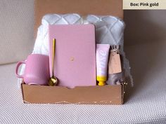 an open box with pink items in it