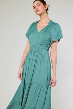 Easy breezy. Done in a lush jade green color, this tiered midi dress is effortlessly pretty. Ruffle trim, fluttery sleeves, and a tiered skirt heighten the feminine allure. •V-neck •Short sleeves •Ruffle trim •Elasticized waist •Tiered skirt DIMENSIONS •Standard: 51" of Length Item number 2290262 100% Polyester Effortlessly Pretty, Collar Maxi Dress, Jade Green Color, Ruffled Collar, Tiered Midi Dress, Easy Breezy, Tiered Skirt, Jade Green, Ruffle Trim