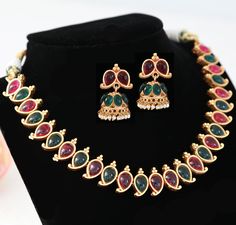 Matte Gold finish antique look  Green and blue kemp stone choker necklace at Indian Designs (available in Pink Green also).  This traditional design South Indian necklace is perfect suit with saree. South Indian Necklace, South Indian Temple, Stone Choker Necklace, Temple Jewelry Necklace, Indian Designs, Stone Necklace Set, Temple Jewelry, Indian Temple, Stone Choker