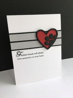 a card with a heart and paw prints on it