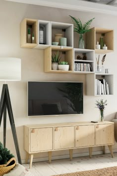 a living room filled with furniture and a large flat screen tv mounted on a wall