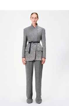 A modern take on the classic tuxedo jacket, this piece is meticulously crafted from 100% Italian wool herringbone in a sharp black and ivory hue. Intricate hand-embroidered crystals adorn the jacket, creating a striking pattern that elevates its timeless design. Featuring a horn button closure and two side pockets, this jacket combines elegant tailoring with a contemporary twist. Style Number: F24801WH Made in New York City Size & FitModel's Height: 5'10"Model is wearing size small Composition & Elegant Tailored Tweed Jacket For Party, Luxury Fitted Tweed Jacket For Evening, Elegant Embellished Fall Outerwear, Chic Embellished Formal Outerwear, Elegant Sequined Blazer For Formal Occasions, Elegant Sequined Suits For Evening, Elegant Spring Evening Tweed Jacket, Elegant Long Sleeve Tweed Jacket For Wedding, Luxury Evening Suits For Spring