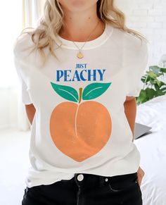 Thanks for checking out this 'Just Peachy' Summer vibes T-shirt. Bright and fun for the beach or any of those sunny summer days! This T-shirt, the Gildan 6400 Soft Style short sleeve tee, is a great fit with a soft feel to the fabric. But also has the same high quality of the well loved standard Gildan tees often used for Biker, work, and athletic tees. This Soft combed and ring spun cotton is a great ground for quality printing. These t-shirts have-ribbed knit collars that keep shape. The shoul Peach Pit Tshirt, Peach Short Sleeve T-shirt For Summer, Casual Peach T-shirt With Graphic Print, Trendy Peach T-shirt With Letter Print, Cute Peach T-shirt With Crew Neck, Trendy Peach Short Sleeve T-shirt, Peach Short Sleeve Summer Tops, Peach Short Sleeve Shirt For Summer, Casual Peach Short Sleeve Top