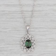 "Gemstone Information: - Natural Tourmaline - Carats - 1.35ct Cut - Oval   Color - Green Metal: 18k White Gold Weight: 3.3 Grams  Stamps: 750 Style: Cable Chain Closure: Spring Ring Clasp Chain Length: 18\" Width: 1.2 mm Pendant dimensions: 24.3 x 14.8 mm Each piece is thoroughly examined and refinished as needed by our professional jewelers, graded by our in-house GIA (Gemological Institute of America) Graduate Gemologist, and inspected for quality before being carefully packaged and promptly s Mens Custom Jewelry, Green Metal, Tourmaline Pendant, Recycled Jewelry, Message Jewelry, Mystic Topaz, Tourmaline Gemstone, Green Tourmaline, Fine Jewellery Necklace