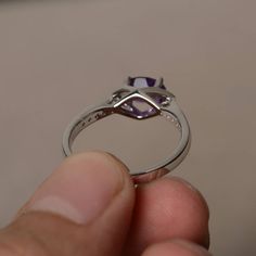 This is a gorgeous handmade creation. Its beauty is its simplicity & Elegance. The 5*7 mm oval shape faceted natural amethyst is crafted in solid sterling silver and with rhodium plated. All item is sent in a beautiful gift box If you have any idea of design your ring,pls contact me directly. You can realize more lovely stuff clicking the link https://www.etsy.com/shop/knightjewelry?refshopsection_shophome_leftnav Please leave the correct address and you phone number for delivering successfu Oval Amethyst Promise Ring With Accent Stones, Oval Amethyst Promise Ring With Prong Setting, Promise Jewelry With Oval Amethyst, Oval Amethyst Promise Ring In Purple, Oval Purple Amethyst Promise Ring, Purple Oval Amethyst Promise Ring, Oval Purple Promise Ring, Oval Purple Birthstone Promise Ring, Oval Faceted Crystal Promise Ring