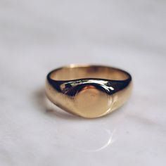 Gold toned brass Small Minimalist Ring in sizes for both men and women. This simple ring has a circular flat face but lot's of style and flat top rings are definitely in right now! Available in 925 Sterling Silver https://etsy.me/2sLAcwj Available in Larger Style https://etsy.me/2CEYcpw Ring Size Available in all sizes. Please be sure to find your exact ring size for the finger you want before ordering. See image chart above or you can use the chart on my website as a guide - https://jewelrylab. Minimalist Adjustable Rings With Smooth Bezel, Classic Adjustable Gold Signet Ring, Everyday Brass Signet Ring, Gold Brass Signet Ring For Everyday, Everyday Polished Signet Ring, Timeless Everyday Brass Rings, Everyday Polished Finish Signet Ring, Everyday Timeless Brass Rings, Everyday Tarnish Resistant Engraved Ring