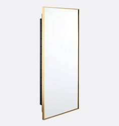 a white and gold framed mirror on a wall