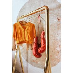 a pair of boxing gloves hanging on a clothes rack