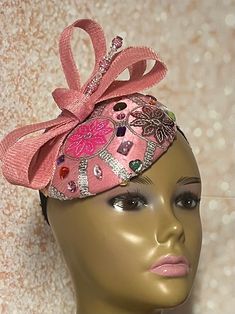 This pink satin fascinator speaks volumes in style. The hat is trimmed with a rhinestones, bows, and a hat pin. The hat pin may vary and is for decorative purposes only. Make a statement with this gorgeous piece! Perfect for church, bridal party, mother of the bride, tea party, cocktails or any other special event. The hat measures approximately 6 inches in diameter. The hat is affixed to the head by a hat elastic/string. Handmade Gifts for mom, sister, wife, or yourself. SHIPPING All items for Kentucky Derby Party Hat With Satin Bow, Elegant Party Hat With Satin Bow, Elegant Hat With Satin Bow For Party, Kentucky Derby Evening Hat With Satin Bow, Spring Party Hats With Rhinestones, Rhinestone Party Hat For Kentucky Derby, Elegant Party Fascinator With Satin Bow, Adjustable Party Headpiece With Rhinestones, Pink Satin Bow Hair Accessories For Spring