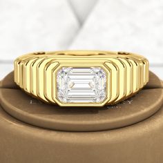 Stand out with this stunning 1.50 Carat Emerald Cut Diamond Chunky Bombe Ring. Crafted with 18K Yellow Gold in the Edwardian Period Maximalist style, this ring is perfect for anniversaries. With a lab-grown diamond, you can feel good about your purchase. Add some elegance to your jewelry collection now.𝐅𝐞𝐚𝐭𝐮𝐫𝐞𝐬:• 𝐌𝐚𝐝𝐞 𝐭𝐨 𝐎𝐫𝐝𝐞𝐫• 𝐌𝐞𝐭𝐚𝐥: 𝟏𝟒𝐊 𝐆𝐨𝐥𝐝 | 𝟏𝟖𝐊 𝐆𝐨𝐥𝐝 | 𝟗𝟓𝟎 𝐏𝐥𝐚𝐭𝐢𝐧𝐮𝐦 • 𝐁𝐚𝐧𝐝 𝐂𝐨𝐥𝐨𝐫𝐬: Rose Gold, Yellow Gold & White Gold• 𝐁𝐚𝐧𝐝 𝐖𝐢𝐝𝐭 Luxury Yellow Gold Emerald Ring For Anniversary, Luxury Gold Emerald Ring With Brilliant Cut, Luxury Gold Emerald Ring With Prong Setting, Luxury Yellow Gold Emerald Ring With Moissanite, Luxury Yellow Gold Moissanite Emerald Ring, Modern Gold Rings Gia Certified, Anniversary Rings With Polished Octagon Shape, Timeless Baguette Cut Signet Ring For Anniversary, Luxury Diamond Ring With Baguette Cut And Bezel Setting