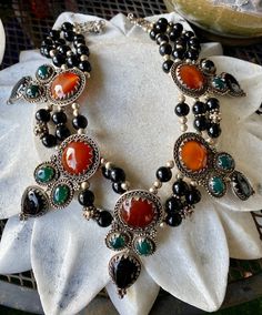 Stunning Bold Beautiful Sterling Silver Carnelian Green and Black Onyx Vintage Bib Festoon Necklace This necklace is absolutley stunning , Not for the faint at heart Measures aprox 16 inches around , necklace has a 2 inches chain extension Each pendant measures over 3 inches See matching earrings in link below https://www.etsy.com/listing/744424320/f?ref=shop_home_active_1&frs=1 Artisan Black Onyx Necklace, Artisan Black Cabochon Jewelry, Handmade Black Bohemian Beads, Gems And Cabochons, Vintage Black Jewelry With Natural Stones, Traditional Black Necklaces With Natural Stones, Unique Black Gemstone Necklaces, Black Carnelian Jewelry With Natural Stones, Unique Black Gemstone Necklace, Black Carnelian Jewelry For Gifts