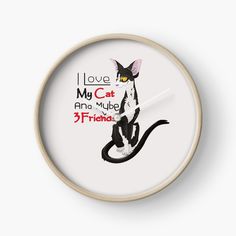 a clock with a black and white cat on it