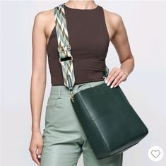 Made From Smooth Vegan Leather, The Demi Bucket Bag By Mersi Features A Roomy Interior With 4 Slot Pockets And A Magnetic Closure. This Listing Is For The Green Color, Which Comes With 2 Adjustable And Interchangeable Straps, And A Removable Mini Pouch. Height- 12" Length- 11" Depth- 5" Trendy Square Hobo Bag For On-the-go, Chic Square Bucket Bag With Single Shoulder Strap, Chic Single Shoulder Bag Strap, Elegant Green Large Capacity Bucket Bag, Elegant Green Bucket Bag With Large Capacity, Green Adjustable Strap For Bags, Everyday Green Adjustable Bag Strap, Green Adjustable Everyday Bag Strap, Green Rectangular Bucket Bag With Detachable Strap