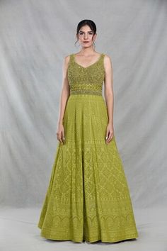 Green sleeveless full length gown with Mughal bloom embroidery using thread, sequin, beads and cutdana highlights. Paired with a ditsy sequin floret work dupatta. - Aza Fashions Sleeveless Green Wedding Gown, Festive Chikankari Embroidered Maxi Dress For Wedding, Sleeveless Gown With Intricate Embroidery For Wedding, Fitted Maxi Length Gown With Chikankari Embroidery, Sleeveless Wedding Gown With Intricate Embroidery, Festive Sleeveless Wedding Dress, Festive Anarkali Sleeveless Dresses, Sleeveless Anarkali Dresses For Festive Occasions, Festive Sleeveless Anarkali Embroidered Dress