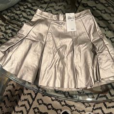 Silver Pleated Skirt. Size Small. Never Worn From Lord And Taylor! Spring Party Flared Skort, Spring Party Skort, Fall Party Skort With Relaxed Fit, Elegant Midi Skort For Spring, Fall Party Relaxed Skort, Relaxed Skort For Fall Party, Relaxed Fit Skort For Fall Party, Spring Party Skort With Full Skirt, Pleated Skirted Skort For Party