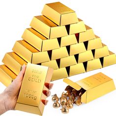 a hand holding a gold bar in front of several stacks of gold nuggets