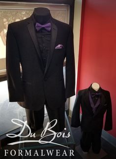 a suit and tuxedo are on display in a museum case with the words du bois formal wear