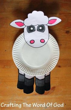 a paper plate with a sheep on it and the words crafting the word of god