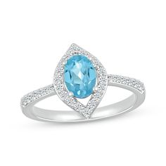 Show off your favorite gemstone in sparkle with this captivating ring. Crafted in sterling silver An oval-cut Swiss blue topaz is accentuated by an open marquise-shaped frame of white lab-created sapphires More white lab-created sapphires add shimmer to the slender shank Marquise Blue Topaz Jewelry With Center Stone, Blue Topaz Marquise Jewelry With Center Stone, Blue Topaz Marquise Cut Gemstone Jewelry, Marquise Cut Blue Topaz Ring, Marquise Cut Blue Topaz Gemstone Jewelry, Fine Jewelry Marquise Topaz Ring With Center Stone, Frame Ring, White Lab, Swiss Blue Topaz