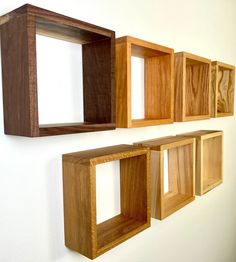 three wooden shelves mounted to the wall