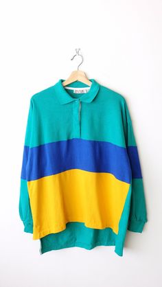 "Vintage Green/Blue/Yellow Color blocked Long Sleeve Polo Shirt/Collared pullover. Measurements Length: 29\" Armpit to armpit: 22 1/2\" Armpit to end of sleeve: 19 1/2\" Condition: Gently used. There's no stains or holes. Good condition.  ※Please read the policy before you purchase.※" Retro Long Sleeve Top With Contrast Color, Yellow Long Sleeve Top With Contrast Color, Green Color Block Long Sleeve Top, Retro Green Patchwork Tops, Retro Long Sleeve Color Block Tops, Green Retro Patchwork Tops, Retro Color Block Long Sleeve Tops, Retro Yellow Color Block Tops, Yellow Retro Color Block Tops