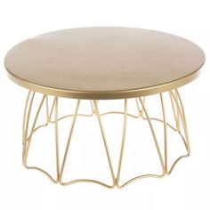 a round coffee table with gold metal frame