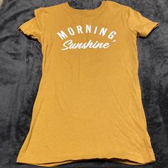 Free State Mustard Yellow Morning Sunshine T-Shirt Washed, Never Worn Mustard Short Sleeve T-shirt With Graphic Print, Yellow Tops With Logo Print, Casual Yellow Slogan Top, Yellow Graphic Tee With Letter Print, Yellow Letter Print Graphic Tee, Yellow Casual Slogan T-shirt, Mustard Graphic Print Cotton T-shirt, Yellow Crew Neck T-shirt With Text Print, Trendy Yellow Tops With Logo Print