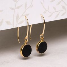 "Black onyx and gold stunning circle drop earrings for her - Unique, elegant, minimalist jewelry gift ideas for you, wife, mom, aunt, niece Stone: Genuine Black Onyx Bezel: Vermeil Gold Ear-wire: 14k Gold Filled Total length of earring: 35mm Circle Gemstone: 12mm diameter About \"Gold Filled Jewelry\": Also called rolled-gold. These jewelry items are not actually filled with gold. They are made of a base metal covered by sheets of gold in a mechanical bonding process. Effectively a thick coat of Black And Gold Earrings, Jingle Jangle, Jewelry Knowledge, Aunt Niece, Jewelry Gift Ideas, Celestial Sun, Thick Coat, Gemstone Drop Earrings, Writing Gifts