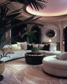 a living room filled with white furniture and lots of plants on top of the tables