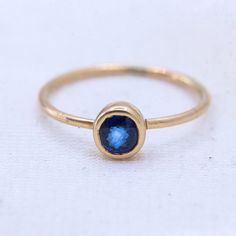 Blue Sapphire Gemstone Ring, 8 US/ 14k Yellow Gold Ring, Gold Jewelry Ring, Faceted Sapphire Gemstone Ring, Statement Ring, Easter Gifts GEMSTONE DETAILS : ✦ Gemstone : Sapphire ✦ Gemstone Shape : Round  ✦ Gemstone Color : Blue  ✦ Gemstone Cut : Faceted ✦ Number of Gemstones : 1 ✦ Gemstone Weight : 0.3 CT's  ✦ Number of Gemstones : 1 ✦ Gemstone Grade: Excellent METAL DETAILS : ✦ Metal : 9K Yellow Gold ✦ Ring Size : 5 US  ✦ Gross Weight : 0.9 Gram  ✦ Setting : Bezel Setting  ✦ Ring Box : Yes CUST Blue Solitaire Birthstone Ring In 14k Gold, Fine Jewelry Blue Sapphire Birthstone Ring, Fine Jewelry Blue Sapphire Ring Birthstone, Blue Sapphire Ring Birthstone Fine Jewelry, Fine Jewelry Sapphire Stackable Birthstone Rings, Stackable 14k Gold Sapphire Ring, Stackable Sapphire Ring In 14k Gold, Everyday Stackable Sapphire Ring Fine Jewelry, Everyday Stackable Sapphire Ring In Fine Jewelry Style