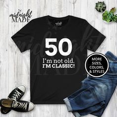 the 50 i'm not old im classic t - shirt is next to jeans and sneakers