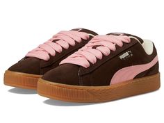 PUMA Suede Xl - Women's Lace up casual Shoes : Chestnut Brown/Peach Smoothie/Frosted Ivory : Give your classic footwear collection a trendy update with the PUMA Suede Xl Sneakers, crafted in a modern street inspired silhouette with contrasting lace-up closure and formstip pattern. The sneakers come with a leather upper, suede tongue with mesh binding, leather lining, and cushioned rubber insole. The PUMA branding on quarter panel and FOT Mesh lining Mesh sockliner with repeat screen printed PUMA branding add both style and authenticity. Leather working group sustainability. Round toe. Rubber outsole. Imported. Measurements: Weight: 1 lb 8 oz Product measurements were taken using size 6, width B - Medium. Please note that measurements may vary by size.