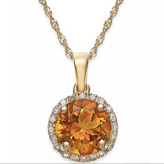 Upgrade Your Style With This 14k White Gold Pendant Necklace. The Round-Cut Citrine (1-1/2 Ct. T.W.) Is Surrounded By Dazzling Diamond Accents. Length: 18 Inches. Drop: 1/2 Inch. Timeless Shine For A Trendy Look! - Citrine: 1-1/0 Ct. T.W. - Diamond Accent - Set In 14k Yellow Gold (Garnet, Citrine) - Approx. Length: 18"; Approx. Drop: 1/2" - Spring Ring Clasp - Round Circle Citrine Gemstone Physical Composition: Citrine Is A Clear Yellow Variety Of Quartz. It Occurs In Proximity To Amethyst And T Gold Necklace With Round Stone In Fine Jewelry Style, Yellow 14k Gold Jewelry With Diamond Accents, Yellow Gold Citrine Jewelry, Exquisite Yellow Gold Citrine Jewelry, Exquisite Citrine Jewelry In Yellow Gold, Elegant Citrine Jewelry With Brilliant Cut, Elegant Brilliant Cut Citrine Jewelry, Formal Gold Necklace With Round Stone, Yellow Gold Citrine Round Pendant Jewelry