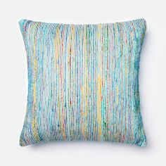 a multicolored striped pillow with blue and yellow stripes on the front, along with a white background