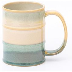 a coffee mug with multiple layers of pastel blue, green and yellow on it