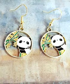 New Handmade Panda Bear Earrings ♡ Colorful enamel Panda Bear charm earrings ♡ Gold tone charm ♡ Gold tone hook back ♡ 1.5 inch long ♡ Hypoallergenic (nickel free) ☆ Matching necklace available in my etsy store Thank you for checking out my online store. I ship within 24 hours of cleared payment Monday-Saturday Cute Round Enamel Jewelry, Yellow Enamel Earrings, Pierced Dangle Earrings In Enamel, Enamel Dangle Hoop Earrings As Gift, Gift Enamel Dangle Hoop Earrings, Nickel Free Enamel Dangle Earrings, Dangle Enamel Hoop Earrings As Gift, White Enamel Hoop Earrings For Gifts, Nickel-free Gold Novelty Earrings