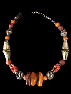 Old Moroccan Amber Necklace Unique Orange Necklace With Polished Beads, Traditional Silver Carnelian Jewelry, Orange Beaded Amulet Jewelry, Orange Beaded Amulet Necklace, Bohemian Orange Hand-strung Necklace, Orange Amulet-style Jewelry With Large Beads, Orange Amulet Beaded Necklace With Large Beads, Orange Amulet Necklace With Round Beads, Orange Amulet Necklace With Large Beads