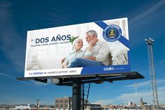 a billboard with an elderly man and woman on it