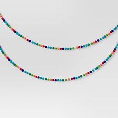 multicolored beaded necklace on white background