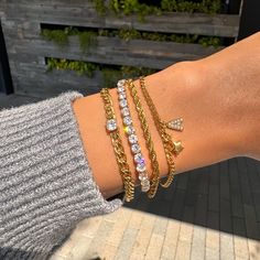 Our Diamond Tennis Bracelet has a unique look that makes it perfect for wearing alone or layering. This bracelet is made using a real 18k gold dipped stainless steel chain and cubic zirconia crystals, which makes it stand out from all the rest. A beautiful piece of jewelry made in California by women who know what they love! ✔Hypoallergenic ✔Quality Guaranteed ✔Water Resistant ✔Handmade COLOR: gold LENGTH: 6.5 inches SIZE: 4mm stones MATERIAL: Stainless steel dipped in 18k gold, cubic zirconia Luxury Everyday Gold Bracelet With Cubic Zirconia, Luxury Everyday Gold Cubic Zirconia Bracelet, Cubic Zirconia Bangle Chain Bracelet For Everyday, Everyday Cubic Zirconia Bangle Chain Bracelet, Minimalist Cubic Zirconia Bangle Chain Bracelet, Trendy Gold Diamond Jewelry, Minimalist Cubic Zirconia Bangle Bracelet, Everyday Gold Plated Tennis Bracelet, Trendy Cubic Zirconia Chain Bracelet For Gift