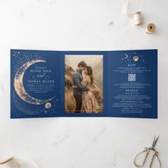 a wedding program booklet with an image of a couple on the moon