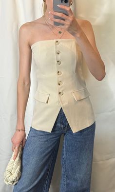 Indulge in the understated elegance of our Taylor Suiting Top. This strapless bustier top is expertly tailored in a luxe beige hue with boning, perfect for any occasion. The sophisticated button down front adds a touch of refinement to this must-have piece. Elevate your wardrobe with this exclusive top. 95% Polyester 5% Spandex Spring Beige Corset With Built-in Bra, Beige Corset With Built-in Bra For Spring, Chic Sleeveless Tube Top For Formal Occasions, Chic Sleeveless Tube Top For Formal Events, Elegant Beige Corset For Spring, Elegant Tube Top For Date Night, Elegant Bandeau Corset, Chic Cream Corset For Spring, Classic Fitted Top For Date Night