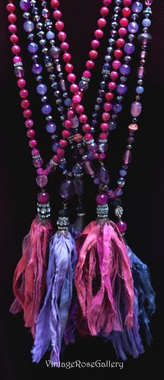 "Purple Pink Sari Silk Tassel Necklace, Pink - Purple Boho Long Necklace, Purple Boho Chic Necklace, Statement Necklace A gorgeous hand made, hand - knotted Sari Silk Tassel with purple , pink and fuchsia Czech glass and crystal beads Features antique iridescent rhinestones, purple, pink and fuchsia Czech glass and crystal beads , a sterling silver thai rosette at the closure , and a jade gemstone with beautiful hand made Purple Sari Silk tassel This necklace is very beautiful and really unique Purple Sari, Pink Sari, Silk Tassel Necklace, Blue Gemstone Bracelet, Boho Chic Necklace, Long Necklace Boho, Necklace Purple, Chic Necklace, Boho Chic Jewelry