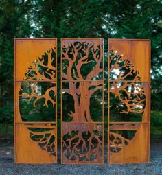 a metal sculpture with a tree on it