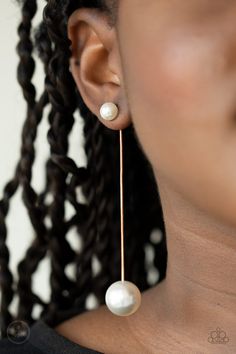 Attached to a sleek gold chain, an oversized white pearl delicately swings from the bottom of a classic white pearl, adding a timeless twist to the elegant display. Earring attaches to a standard post fitting.

 Sold as one pair of post earrings. Bedazzled Jewelry, Paparazzi Accessories Jewelry, Gold Jacket, White Pearl Earring, Earring Jackets, 25 21, Gold Pearl Earrings, Paparazzi Accessories, White Rhinestone