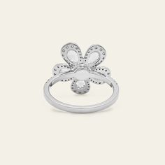 A mix of luminous diamond cuts forms a hypnotic bloom in the Diamond Forget-Me-Knot Ring. Pear-shaped rose-cut diamonds individually surrounded with round diamond halos comprise the petals that emanate from a round diamond center stone. Further diamonds form a partial eternity style on the 18-karat white gold band. Snap up this flower that will never wilt and die. Details18K White Gold1.40 Carats of Diamonds5 Pear-Shaped Rose-Cut Diamonds Totaling 0.81 Carats80 Round Diamonds Totaling 0.59 Carat White Cluster Lab Grown Diamond Jewelry, Flower Shaped Diamond White Ring With Diamond Accents, Diamond White Flower-shaped Ring With Diamond Accents, White Diamond Flower-shaped Ring With Accents, Diamond White Flower Shaped Diamond Ring, Fine Jewelry Flower Ring With Halo Design, White Cubic Zirconia Cluster Ring With Halo Design, White Cluster Ring With Halo Design In Cubic Zirconia, Fine Jewelry Diamond Ring In Flower Shape