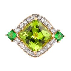 This collection features an array of pretty peridot rings! Accented with diamonds these rings are made in yellow gold and present a vibrant and fresh look. Classic peridot ring in 18K yellow gold with diamonds. Peridot: 4.75 carat cushion shape. Tsavorite: 0.406 carats square shape. Diamonds: 0.574 carat, G colour, VS clarity. Gold: 5.0938g, 18K yellow gold. Ring Size: US 6.75 - Size can be adjusted for free upon request - please reconfirm with your order. R644 Luxury Gold Tsavorite Rings, Luxury Unique Peridot Rings, Luxury Peridot Three-stone Rings, Peridot Rings, Peridot Ring, 18k Yellow Gold Ring, Fresh Look, High Jewelry, Jewelry Rings Engagement