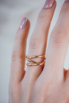 This beautiful wrapped ring will become a staple in your wardrobe! This ring is handcrafted out of a D-shaped (half round) wire, and is a thicker take on our classic wrap-style ring. This listing is for ONE single ring in solid 14K ROSE GOLD. SIZING NOTE: Because this style is wider than a classic Stacking Ring, we recommend sizing up* by a QUARTER to a HALF size from your US Fashion Ring Size (Bridal size is different than US Fashion Ring Sizing!). Sizing up when purchasing a larger ring style Elegant Spiral Stackable Rings, Elegant Gold Spiral Stackable Rings, Elegant 14k Gold Spiral Rings, Rose Gold Stackable Rings With Modern Twist, Rose Gold Stackable Open Rings With A Modern Twist, Modern Twist Infinity Rose Gold Rings, Modern Twist Rose Gold Infinity Ring, Minimalist Rose Gold Infinity Ring, Modern Twist 14k Rose Gold Stackable Rings