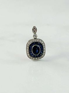 0.78-carat center, 0.50-carat sides blue sapphire, and diamond pendant necklace in 900 platinum. Platinum Pendant, Deco Blue, French Cut, Studded Necklace, Blue Sapphire Diamond, Eternity Band Ring, Deco Jewelry, Pendant Rings, Diamond Pendant Necklace